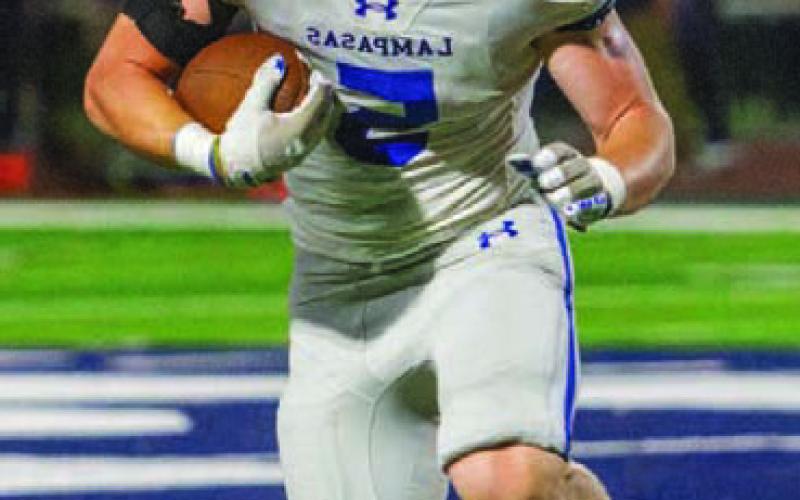 Tight end Cayhil Isom picks up yards after catch and anticipates the tackle. ANA SOFIA MEYER | DISPATCH RECORD