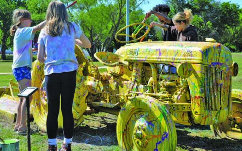 FILE PHOTO At the 2023 Arts in the Park for Kids festival, visitors were encouraged to help repaint a tractor in Campbell Park.