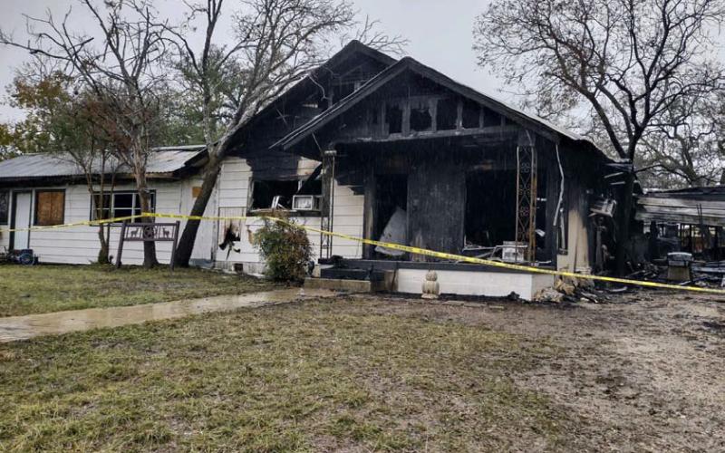 Fire caused extensive damage Sunday to this West First Street house and adjacent apartment. The occupants and their pets were able to evacuate safely, but the structures have been deemed a total loss. DAVID LOWE | DISPATCH RECORD