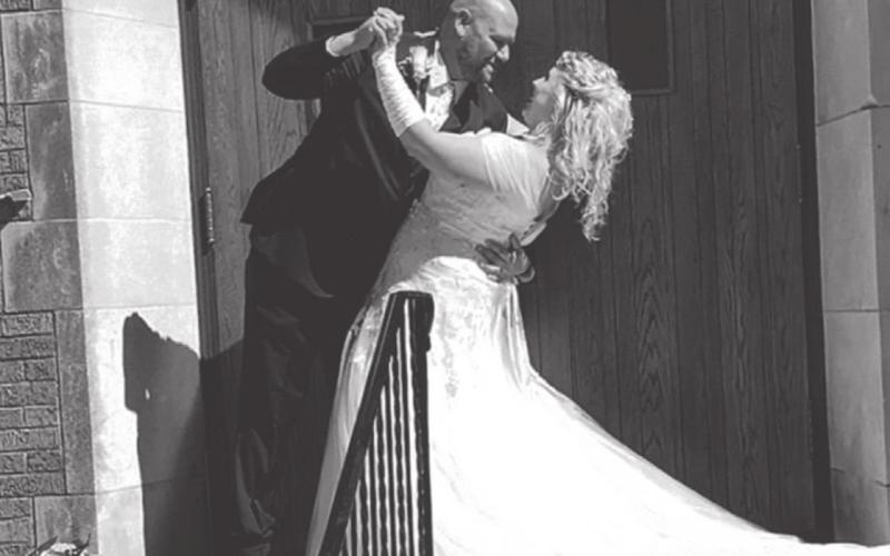 Celebrating outside the United Methodist Church in Cropsey, Illinois, are newlyweds Joshua Schmidgall and his bride, the former Rachel Wolfe. COURTESY PHOTO