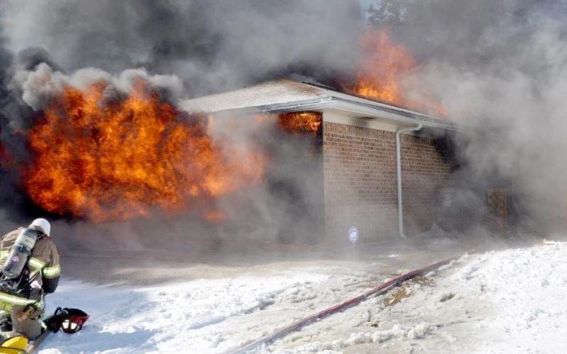 More than 20 firefighters from three departments, including Lampasas firefighter Jared Payne (pictured above) battled a structure fire southeast of Kempner on Tuesday.
