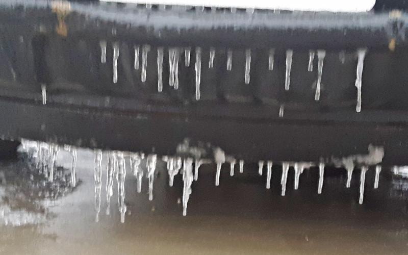 Icicles hang from a pickup on Thursday.