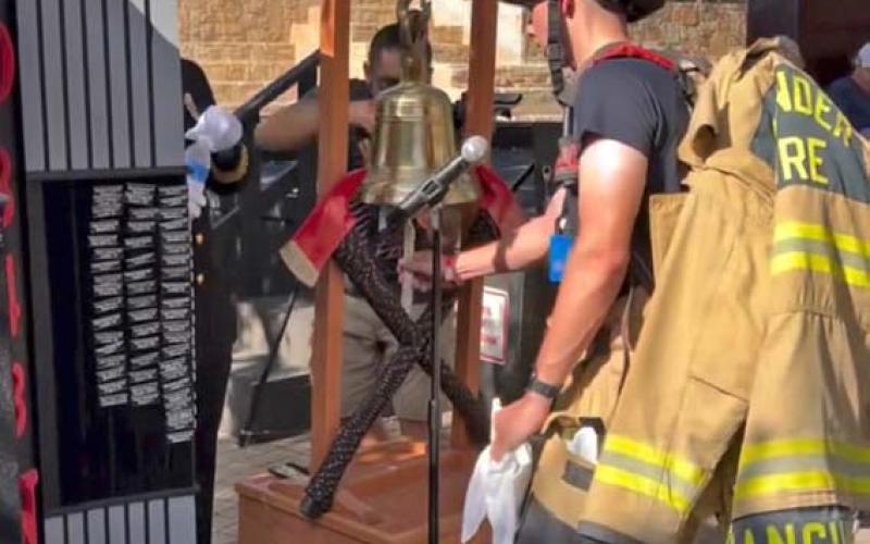 courtesy photo Hunter Sanguinet, a firefighter for the communities of Leander and Lampasas, rings the ceremonial bell upon completing the San Antonio 110. The bell toll memorializes a fallen first responder.