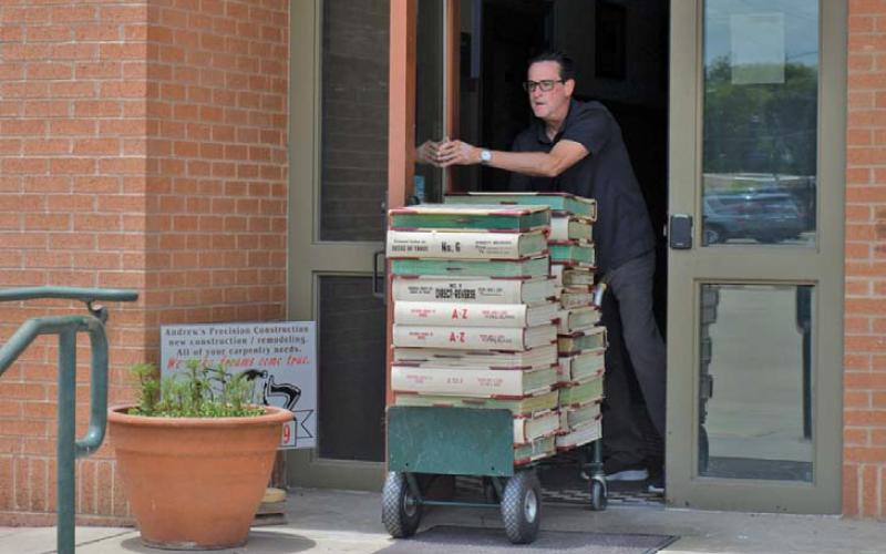Kofile Premium Services representatives were in Lampasas in June to transport 30 years’ worth of deed records and index books from the Lampasas County Clerk’s Office to its headquarters in Dallas where digitization of the records has taken place. file photo