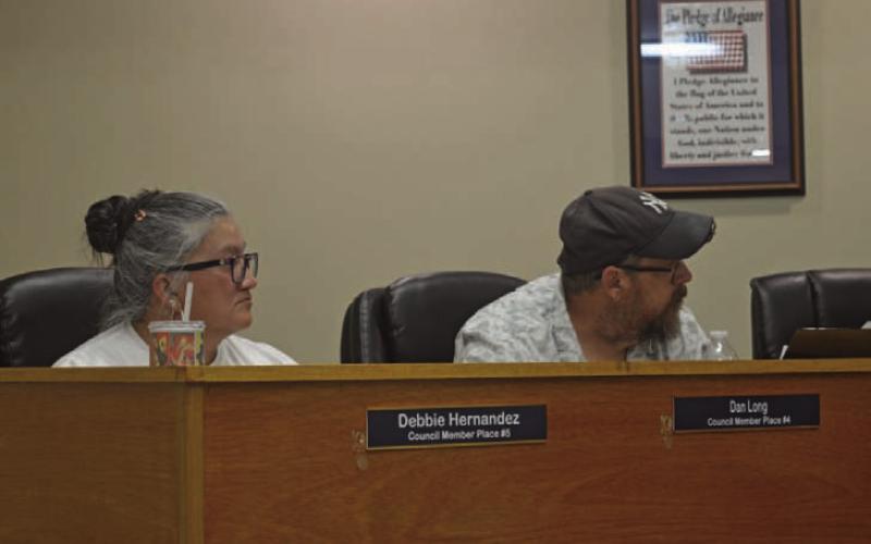 Kempner City Council members Debbie Hernandez and Dan Long look on during the council meeting held on July 23. ERICK MITCHELL | DISPATCH RECORD