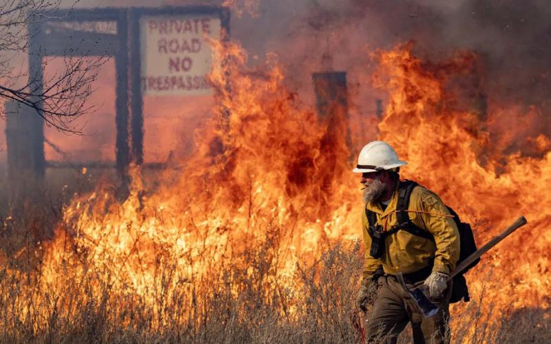 Firefighters battle parts of the reignited Smokehouse Creek fire outside of Miami, Texas on Saturday. SAM CRAFT | TEXAS A&amp;amp;M AGRILIFE MARKETING AND COMMUNICAITONS