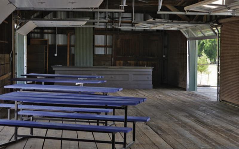 This look shows the interior of the old freight area at the Santa Fe Depot property. Behind the tables and benches is a 1,000-pound, granite-topped bar that will serve adult beverages during the Lampasas Depot Foundation’s upcoming event July 12. ERICK MITCHELL | DISPATCH RECORD