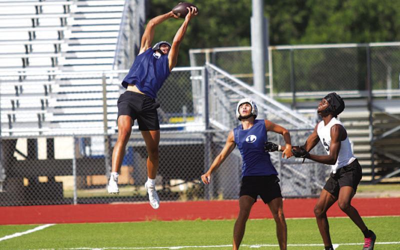 HUNTER KING | DISPATCH RECORD Rylan Chapa goes up high to catch an interception.