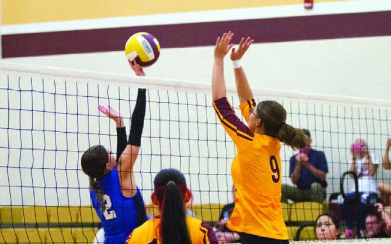Senior middle blocker Cheyenne Weems lays down a big block for the Lady Hornets. ANA SOFIA MEYER | DISPATCH RECORD