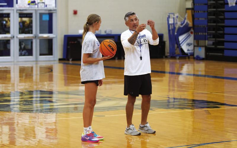 HUNTER KING | DISPATCH RECORD Girls’ basketball coach Marcus Chapa coaches up Corley Eckermann during the girls’ basketball camp last Wednesday.