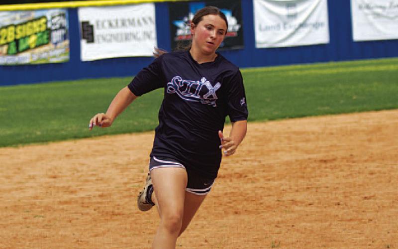 Kadi-Ann Harris runs the bases at softball camp. HUNTER KING | DISPATCH RECORD