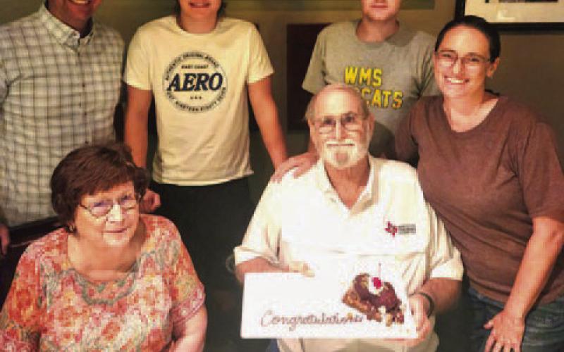 Family members surprised Steve “Doc” Forsythe with a congratulatory dessert to celebrate his honorary recognition by the Texas FFA Association. On the front row with Forsythe are his wife, Cynthia, at left, and daughter, Mary Forsythe Buzzell; at back are son-in-law David Buzzell, and grandsons Keegan Buzzell and Camden Buzzell. COURTESY PHOTO