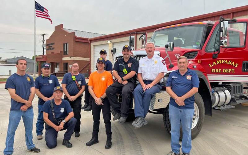 Members of the Lamasas Volunteer Fire Department pose outside the fire station with Lampasas Fire Chief Jeff Smith and one of the fire engines. With volunteer numbers at a low point, there are more vehicles than volunteers available to drive them, officials said. courtesy photo
