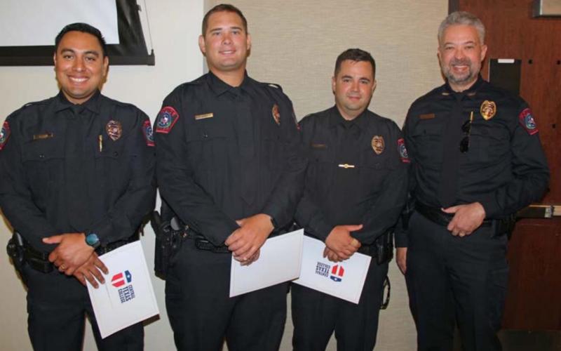 Lampasas Police Chief Jody Cummings (far right) congratulates new cadets, from left to right, John Reza, Jameson Varnado and Brandon English at the Central Texas College Police Academy graduation ceremony. courtesy photo