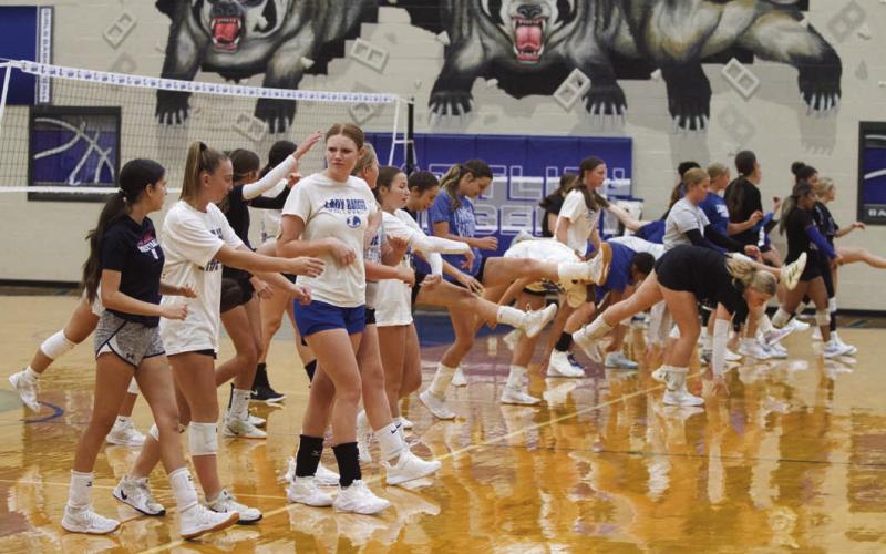 The Lampasas High School Lady Badger volleyball team goes through their warm-up routine before practice on Tuesday. ERICK MITCHELL | DISPATCH RECORD
