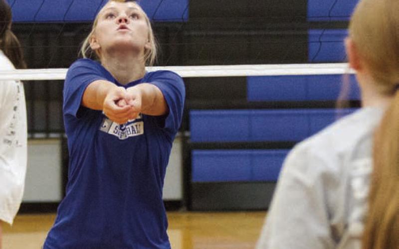 Addison Phillips returns the ball to a teammate. ERICK MITCHELL | DISPATCH RECORD