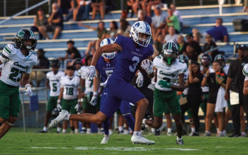 Wide receiver Tripp Stinnett catches a pass from quarterback Ross Kothmann and finds a gap in the Cougars’ secondary for a first down. Stinnett had two receiving touchdowns on the night. ANA SOFIA MEYER | DISPATCH RECORD