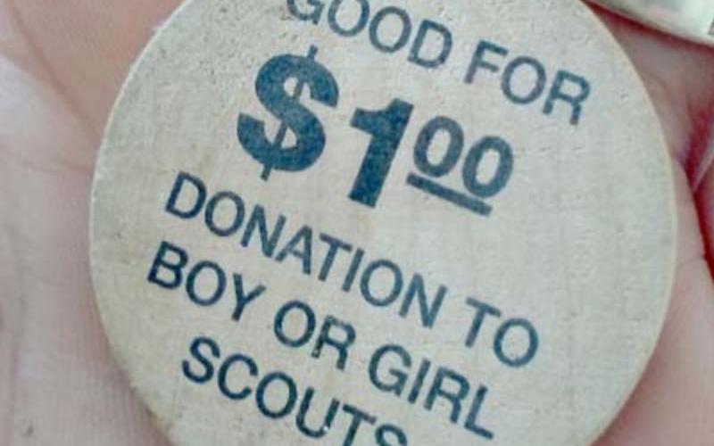 Gina Garner found 672 wooden tokens redeemable for a donation from the Hoffpauir Auto Group to the Boy Scouts or Girl Scouts. COURTESY PHOTO