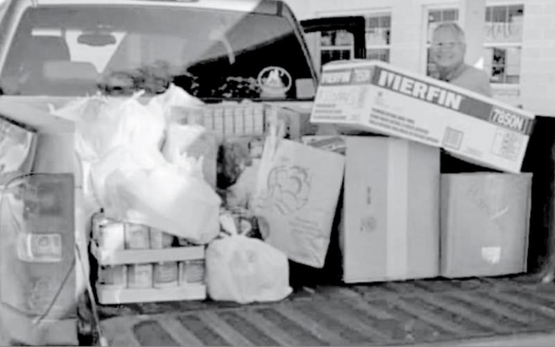 Dennis James transported half of the items collected in the Hanna Springs school food drive to the St. Mary Catholic Church food pantry. The other half went to Lampasas Mission. COURTESY PHOTO
