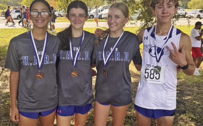 KIMBERLY BURNSIDE | COURTESY PHOTO From left, Addi Ortegon, Alix McMasters, Hadlee McCorkle and Cohen Watson wear the medals they brought home from Friday’s Temple Invitational.