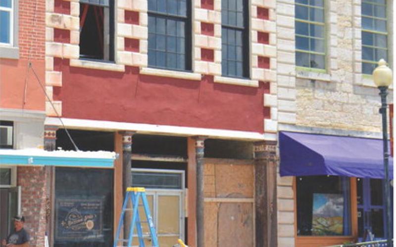 Stripping away brick on the facade of 513 E Third Street revealed ornate steel columns that have been in place for at least 100 years. Owner and renovator Travis Redding hopes to restore the building to its 1870s era glory. ALEXANDRIA RANDOLPH | DISPATCH RECORD