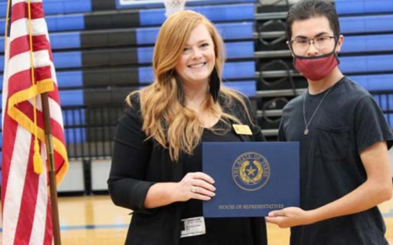 District Director Jessica Diem presents a certificate of recognition to senior Christian Carrasco on behalf of State Rep. Brad Buckley. CHRIS YBARRA | DISPATCH RECORD