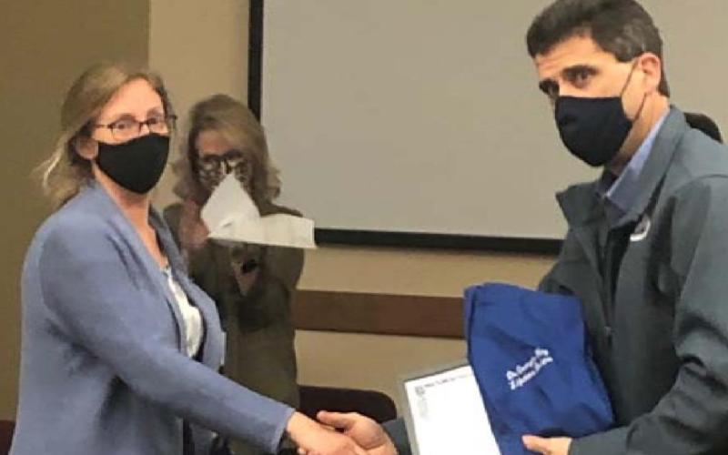 Superintendent Dr. Chane Rascoe presents a certificate of appreciation and “Lifetime Badger” shirt to Dr. Georgia Hay, the local health authority, for her service to the district this year. COURTESY PHOTO