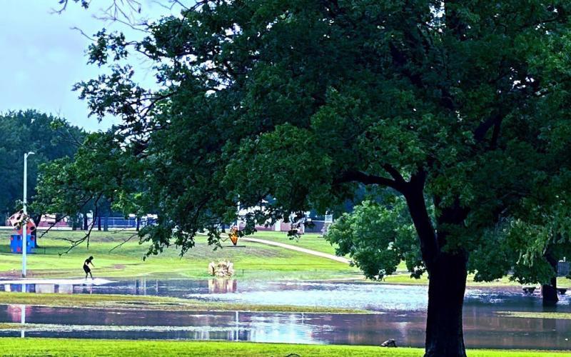Heavy rains soaked Lampasas on Thursday and turned Campbell Park and the Hanna Springs Sculpture Garden area into a retention pond for the water. One teenager took advantage of the pooling effect and enjoyed skimming over the surface. STEPHANIE FITZHARRIS | COURTESY PHOTO