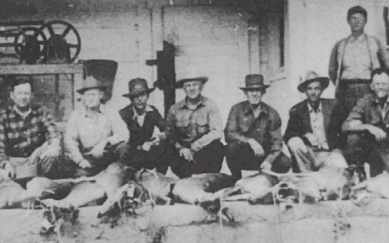 Deer hunters photographed at historic ice house