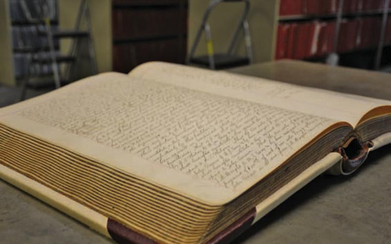 Property title and deed documents are currently kept in hardbound books at the County Clerk’s Office. ERICK MITCHELL | DISPATCH