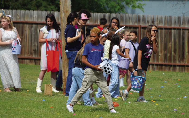 Children await the OK from Lily Springs staff to commence Friday’s egg hunt. ERICK MITCHELL | DISPATCH RECORD