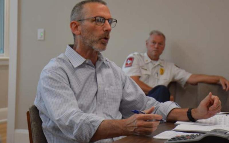 City Manager Finley deGraffenried talks to the Lampasas City Council during a budget roundtable session earlier this month, as Fire Chief Jeff Smith listens in the background. MONIQUE BRAND | DISPATCH RECORD