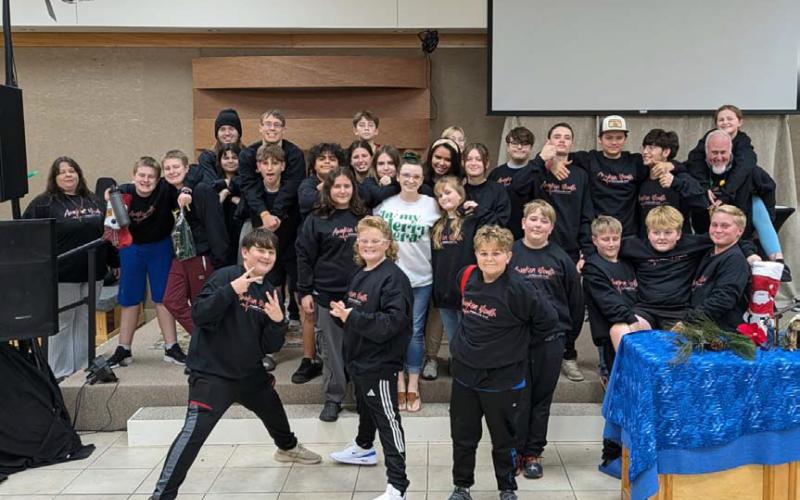 courtesy photo The Awaken Youth group has conducted several community service projects, including collecting over 1,000 cans of food for Lampasas Community Kitchen, leading worship at Fields of Faith, distributing school supplies and more.