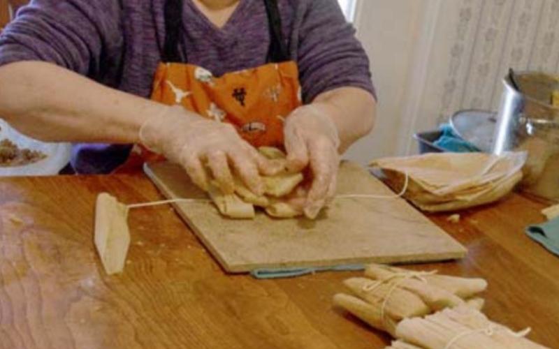 Leonila Gill assembles tamales, which she often makes in batches of 12 dozen at Christmastime. MADELEINE MILLER | DISPATCH RECORD