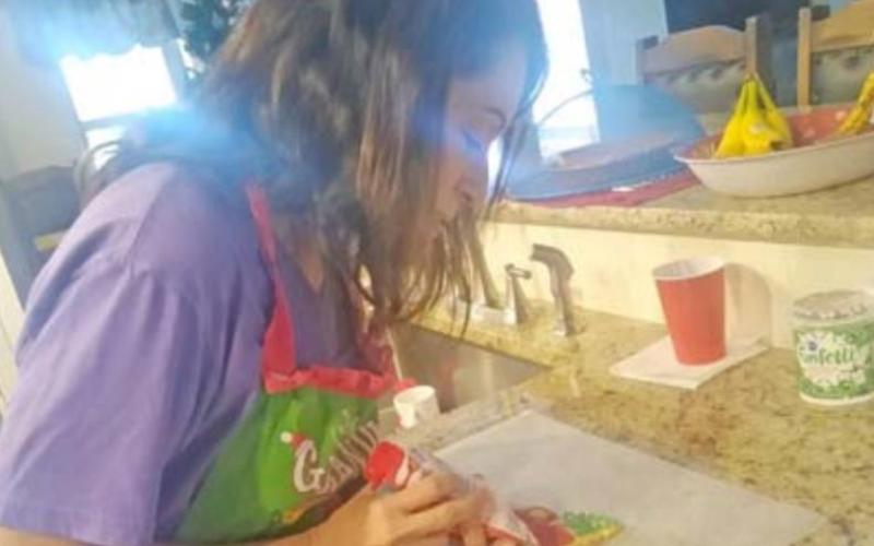 Dianne Miller frosts a sugar cookie. COURTESY PHOTO