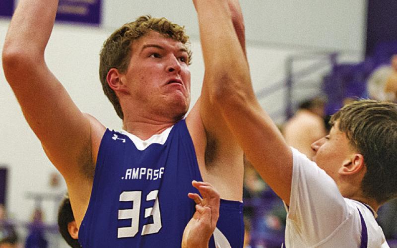 Beau Patterson towers over a Marble Falls defender during his senior year at Lampasas. FILE PHOTO