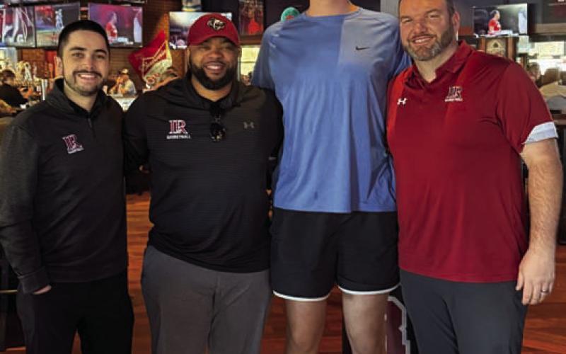 Beau Patterson meets with coaches from Lenoir-Rhyne University, a North Carolina school that has competed in back-to-back NCAA Division II regional championships. COURTESY PHOTO