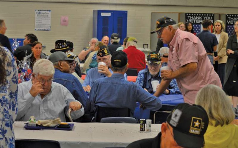 U.S. military veterans share conversations during breakfast served by Lampasas Middle School students before the campus’ 22nd annual Veterans Day ceremony. erick mitchell | dispatch record