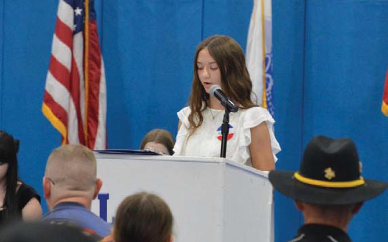 Hayden Harton reads from her essay, highlighting how veterans make life easier at home through their sacrifices on behalf of the nation. erick mitchell | dispatch record