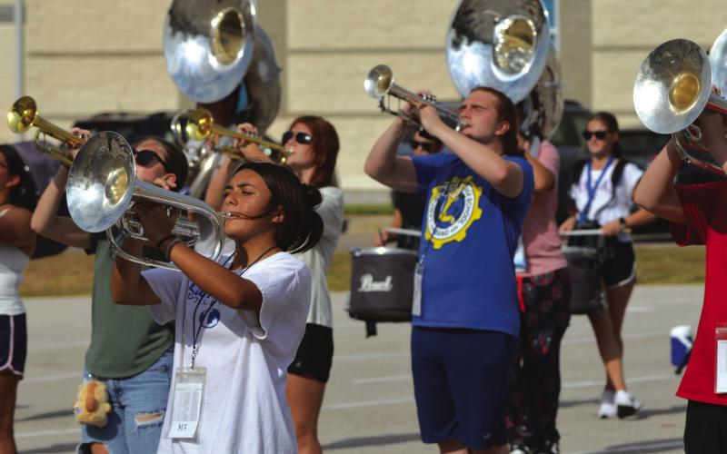 The Lampasas Badger Band practices its new fall marching show, “Rio – City of Rhythm,” after school on Tuesday. The band will debut some of its performance at tonight’s football game in Gatesville. ERICK MITCHELL | DISPATCH RECORD