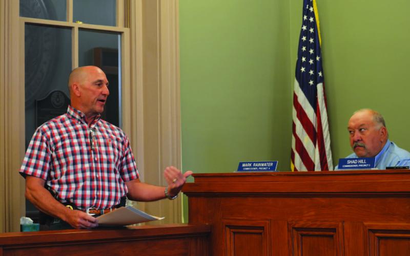 Sheriff David Parker, at left, addresses Commissioner Mark Rainwater and others on the Commissioners Court to offer details on a new jail agreement to house San Saba County inmates at the Lampasas County Jail. ERICK MITCHELL | DISPATCH RECORD