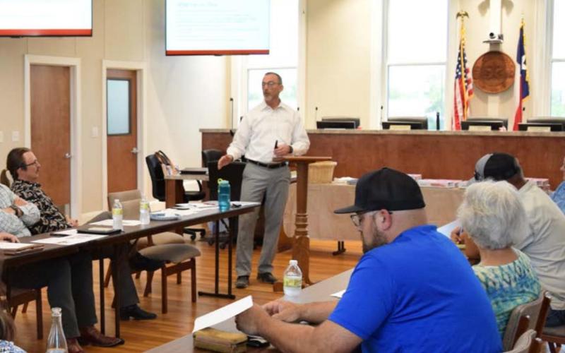 Lampasas City Manager Finley deGraffenried, center, speaks about the capital improvement projects budget at a special City Council workshop. ALEXANDRIA RANDOLPH | DISPATCH RECORD