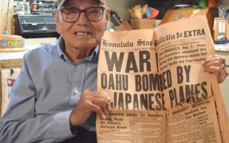 Guadalupe “Wally” Dimas, 94, served his country for more than 40 years in the Army and National Guard. He is pictured here with a newspaper from December 1941, right after the Japanese attack on Pearl Harbor. ALEXANDRIA RANDOLPH | DISPATCH RECORD