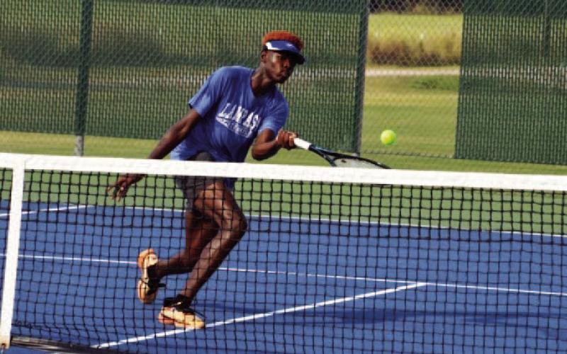 Cinai Brady-Testamark levies a volley for the Badgers in Friday’s tennis match at Leander. C OURTESY PHOTO |