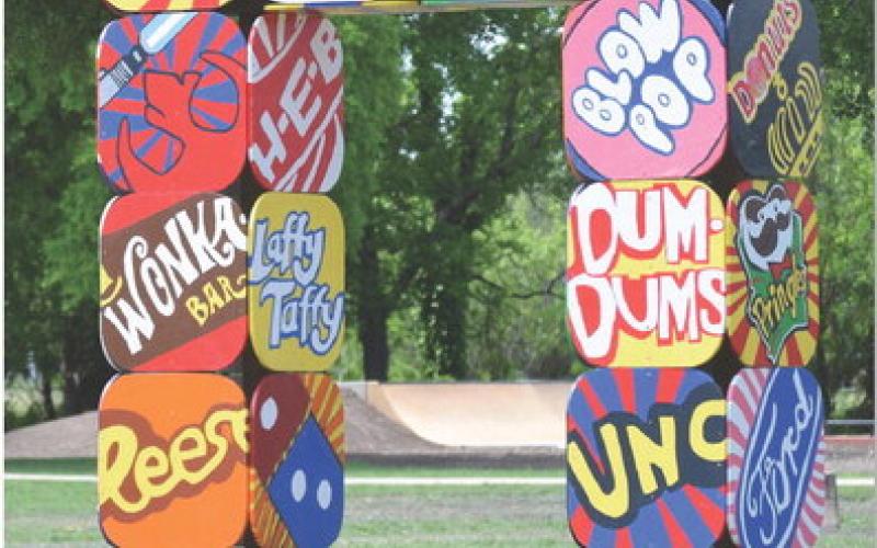 The Pop Art Portal, designed and created by Mike Kuehne’s sixth-grade art classes, stands tall in the Hanna Springs Sculpture Garden. See related photo on page 10. ALEXANDRIA RANDOLPH | DISPATCH RECORD