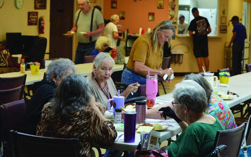 Congregates get ready to dig into their meals Tuesday at the Lampasas Senior Center. The center is seeking more donations for its Meals on Wheels program as 31 seniors are currently waitlisted to be served. ERICK MITCHELL | DISPATCH RECORD