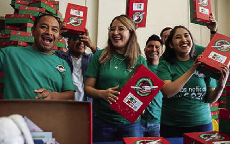 Volunteers such as these pack shoebox gifts to be sent to children around the world. Operation Christmas Child is a ministry of Samaritan’s Purse. National Collection Week for the shoeboxes will be Nov. 16-23. COURTESY PHOTO | SAMARITAN’S PURSE