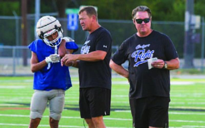 At right, head coach Troy Rogers looks on during scrimmage action. ERICK MITCHELL | DISPATCH RECORD