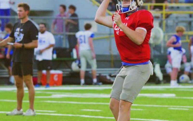 Sophomore quarterback Ross Kothmann eyes his receiver during last week’s scrimmage againsst McCallum. ERICK MITCHELL | DISPATCH RECORD