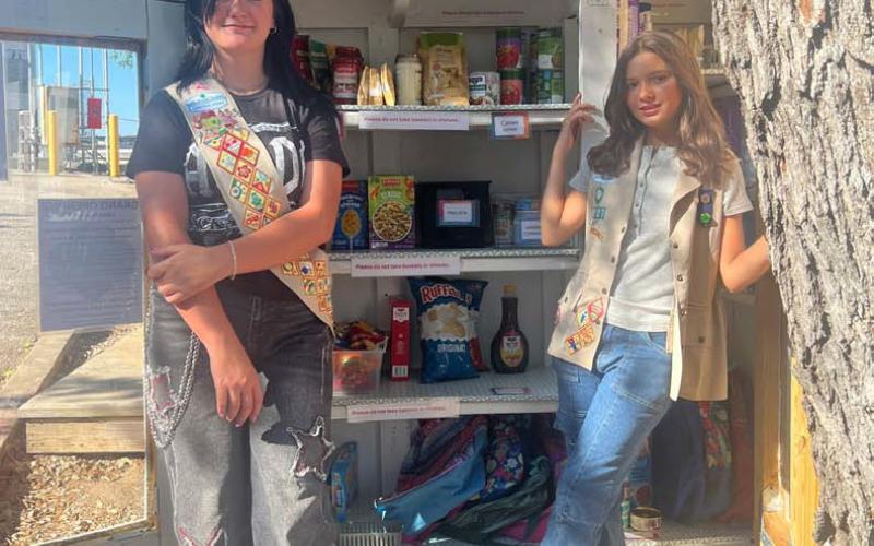COURTESY PHOTO Belle Wharton and Kenzie Woodfin are cadette Girl Scouts working on their Silver Award. The food pantry will be an ongoing project they maintain.